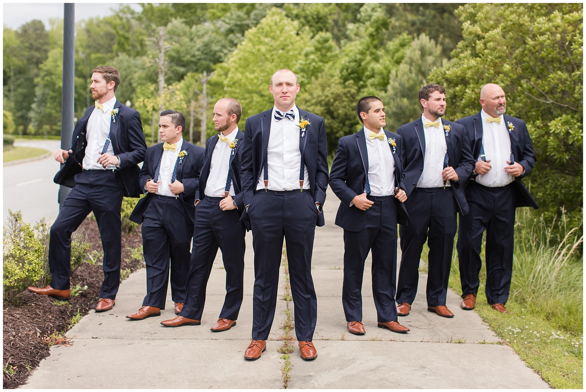groom and groomsmen wearing suspenders 