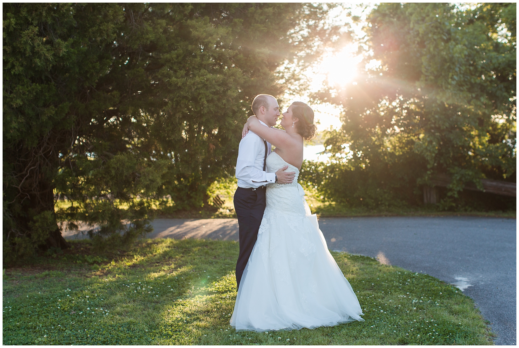 bride and groom hugging at sunset