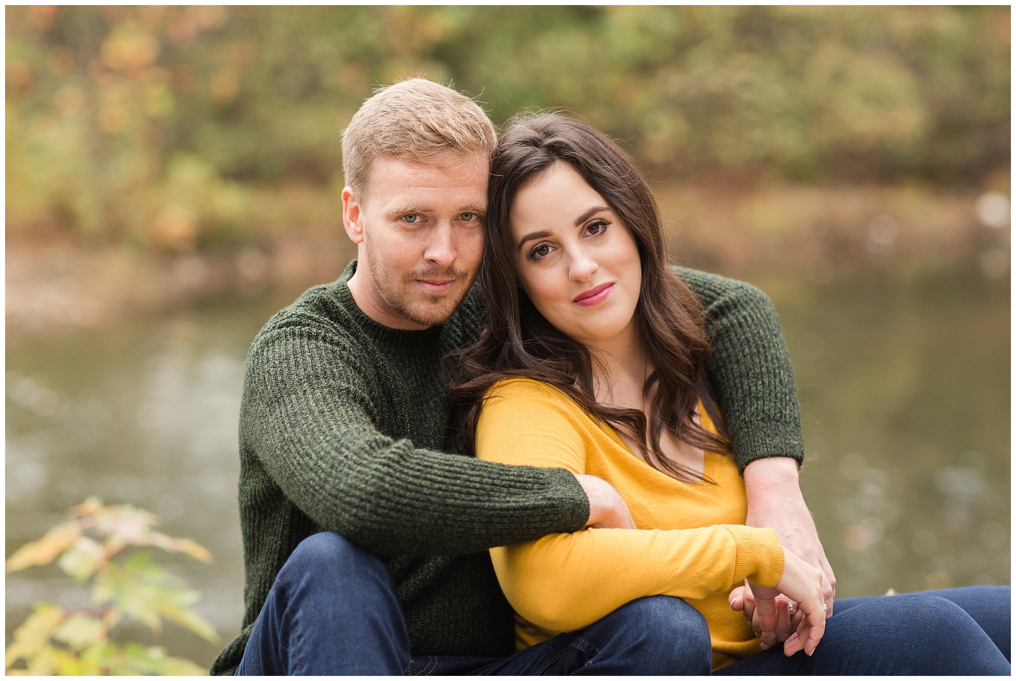 couple posing for fall engagement pictures