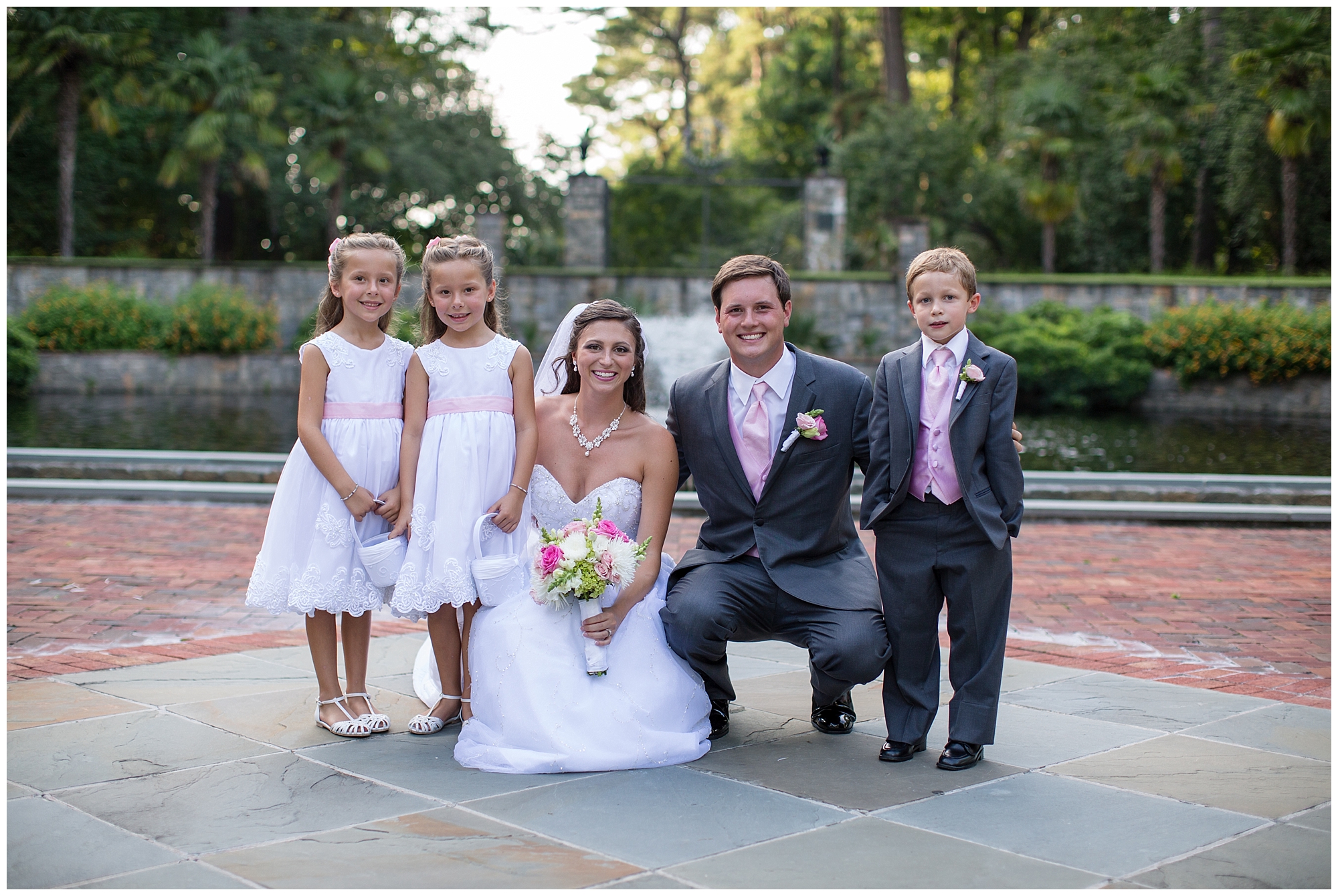 bride and groom with children