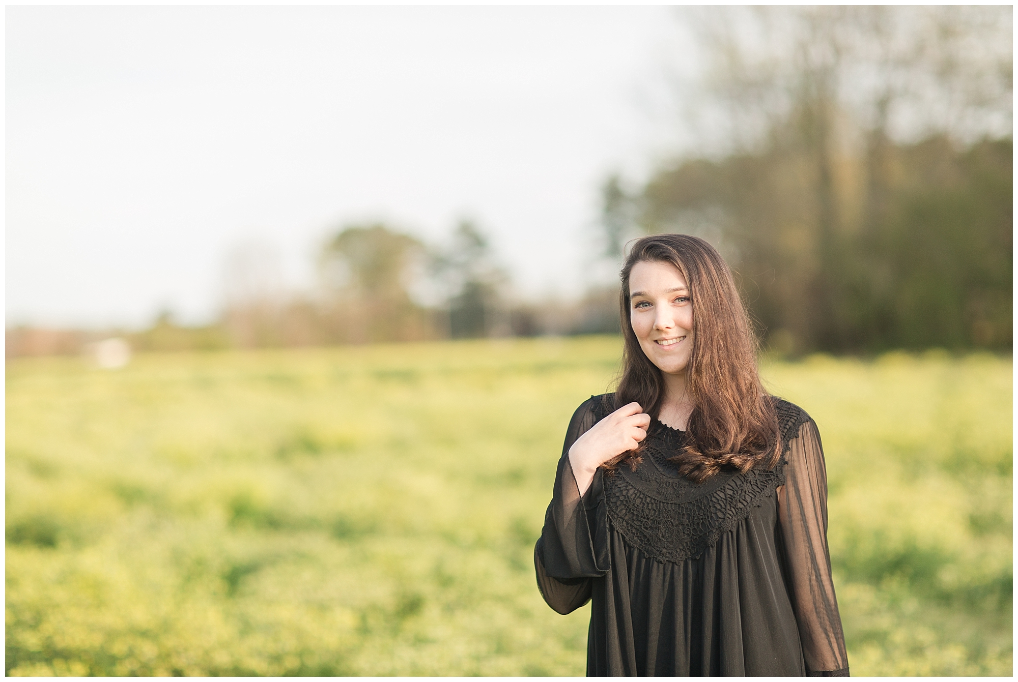 girl in a field of wild flowers senior session Kelley Stinson photography