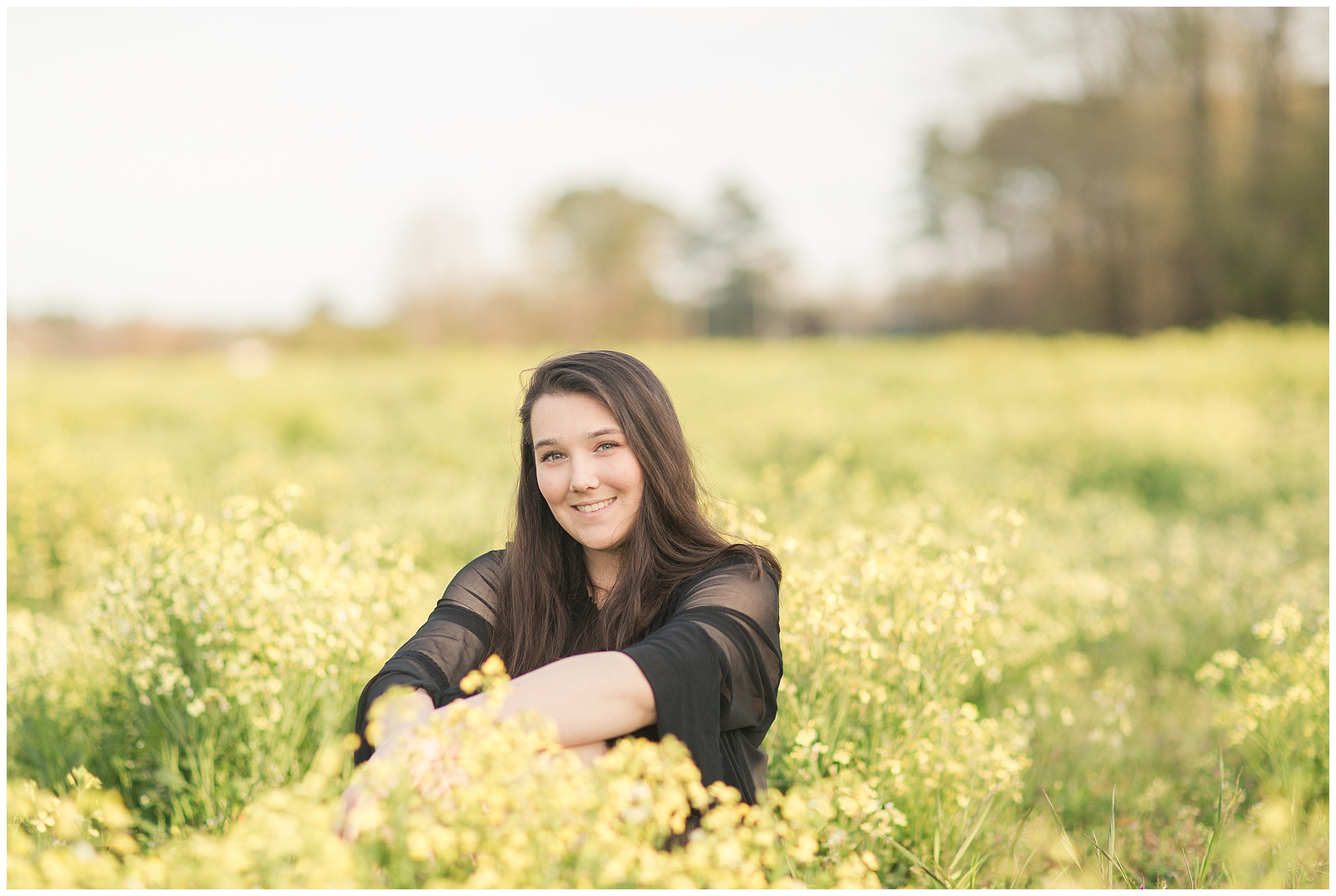 girl in a field of wild flowers senior session Kelley Stinson photography