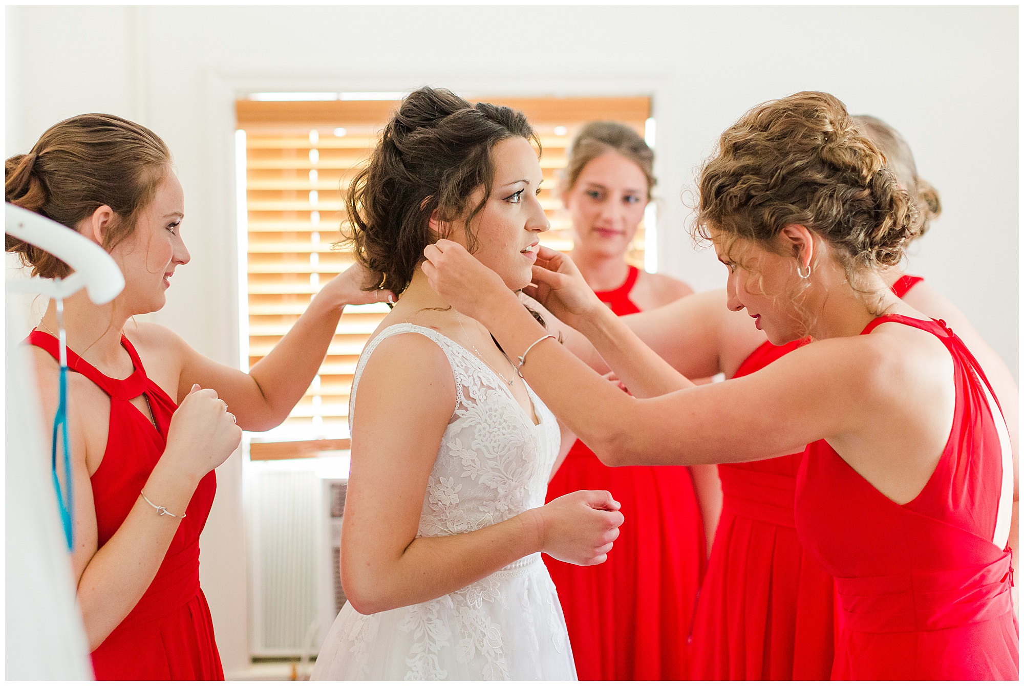 bride getting ready, red bridesmaid dresses